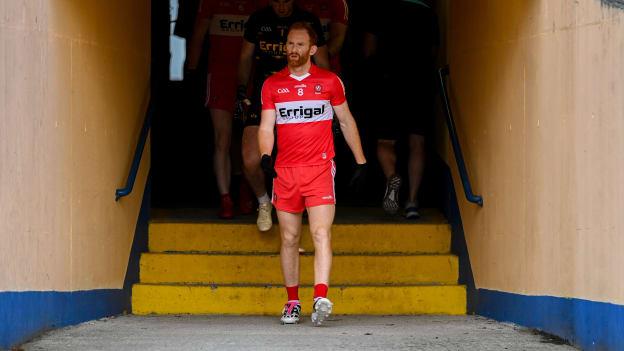 Conor Glass leads the Derry team out at Glennon Brothers Pearse Park. Photo by Stephen Marken/Sportsfile