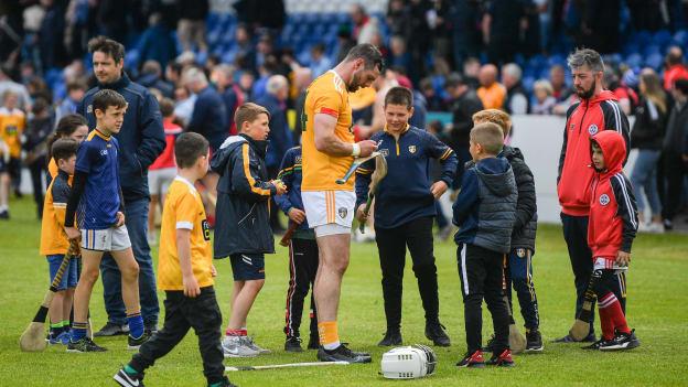 Neil McManus of Antrim signs autographs after the GAA Hurling All-Ireland Senior Championship Preliminary Quarter-Final match between Antrim and Cork at Corrigan Park in Belfast.