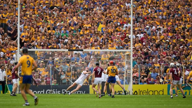 Peter Duggan scores Clare's second goal past Galway goalkeeper James Skehill. 