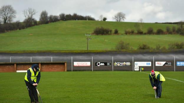 Groundsmen tend to the pitch prior to Sunday's game.