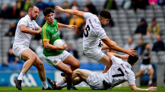 Jason Scully, Meath, in action against Kildare's Mark Grace, Omar Dunne, and Owen Whelan in the Leinster Junior Football Championship Final at Croke Park.