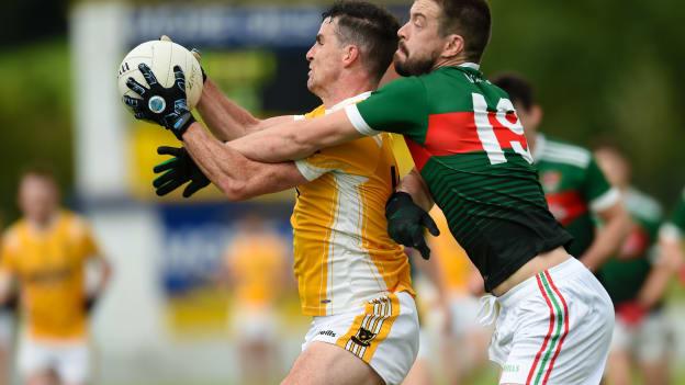 Pauric Boyle, Clontibret O'Neills, and Matthew McKenna, Inniskeen, in Monaghan Senior Football Championship action.