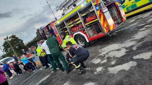 Oola's Ball4All children taking on the local fire-brigade in a tug of war contest...and winning!