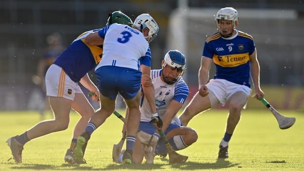 Paddy Leevy of Waterford gathers possession ahead of team-mate Rory Furlong, 3, and Tipperary players Dara Stakelum, left, and John Campion during the Munster GAA Hurling U20 Championship Quarter-Final match between Tipperary and Waterford at Semple Stadium in Thurles, Tipperary. 