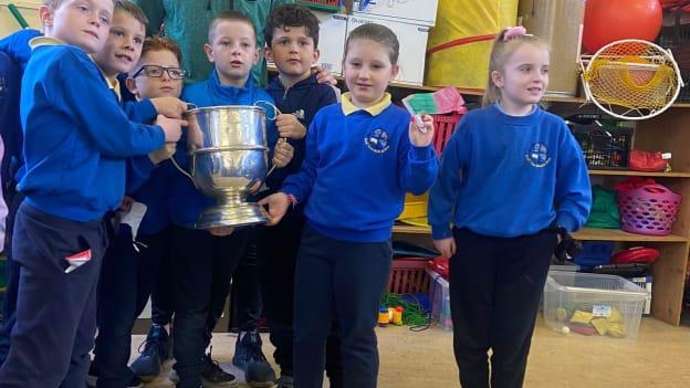 Ballina Stephenites goalkeeper, David Clarke, pictured bringing the Moclair Cup to local school-children. 