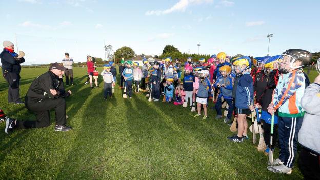 Down senior hurling team manager, Ronan Sheehan, talking to young Down hurlers and camógs. 