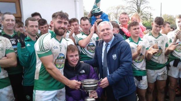 Shamrocks players celebrate with the Cup after winning the Waterford Junior Football Championship. 