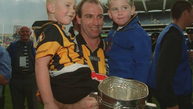 DJ Carey of Kilkenny, holding the Liam MacCarthy cup, with his two sons, Michael, aged 3, and Sean, aged 5, following their victory in the 2002 All-Ireland Senior Hurling Championship Final over Clare. 