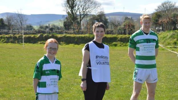 Saoirse and Orla Tyrrell with Ballymanus and Wicklow footballer Mark Kenny.