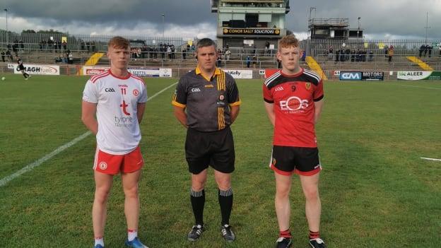 Tyrone captain Cormac Devlin and Down captain Tom Carroll line up before the throw in at Healy Park tonight.  