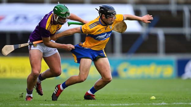 David Reidy of Clare is pulled back by Conor McDonald of Wexford during the GAA Hurling All-Ireland Senior Championship Qualifier Round 2 match between Wexford and Clare at MW Hire O'Moore Park in Portlaoise, Laois. 