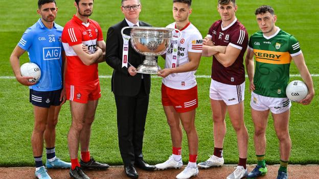 Michael McKernan of All-Ireland Champions Tyrone and Ard Stiúrthóir of the GAA Tom Ryan with the Sam Maguire Cup and footballers, from left, Niall Scully of Dublin, Christopher McKaigue of Derry, Shane Walsh of Galway and Paudie Clifford of Kerry during the launch of the GAA Football All Ireland Senior Championship Series in Dublin. 