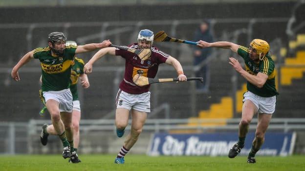 Cormac Boyle holds off Darren Dineen and Tom Murnane.