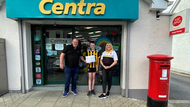 Centra and Crossmaglen Post Office manager Colm Devlin pictured with Crossmaglen Rangers PRO Roisin Murtagh and her son Ruairi. 