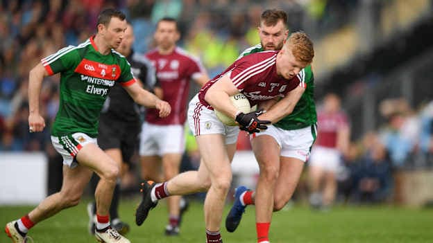 Galway's Seán Andy Ó Ceallaigh surrounded by Mayo's Keith Higgins and Aidan O'Shea in a 2018 Connacht SFC clash at Elverys MacHale Park.