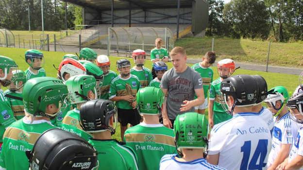 Clare dual star, Podge Collins, talks to development squad hurlers from Fermanagh and Cavan. 