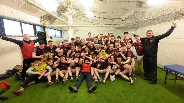 Omagh CBS players and management celebrate after their MacRory Cup Final triumph. 