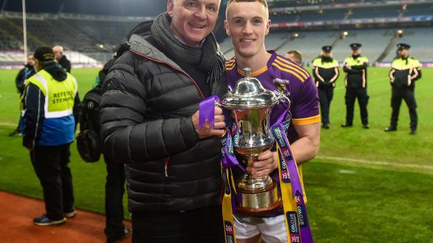 Kilmacud Crokes' captain Shane Cunningham with 1995 All-Ireland winning Kilmacud Crokes' captain Mick Dillon after the AIB GAA Football All-Ireland Senior Club Championship Final match between Glen of Derry and Kilmacud Crokes of Dublin at Croke Park in Dublin. 
