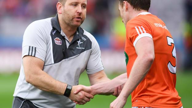 Kildare manager Cian O Neill congratulates Armagh full back Charlie Vernon.