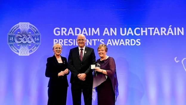 Marian McCarthy of St Finbarr’s, Cork, is presented with the Camogie Award by Maolmhuire Tynan, Head of Public Affairs AIB, and Uachtarán Chumann Lúthchleas Gael John Horan during the GAA President’s Awards at Croke Park in Dublin.