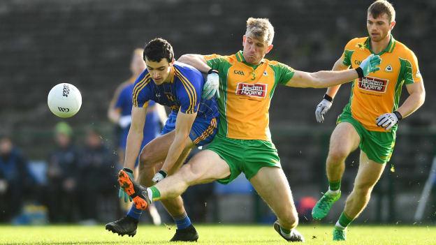 Ciaran Lennon, Clann na nGael, and Kieran Fitzgerald, Corofin, collide at Dr Hyde Park.