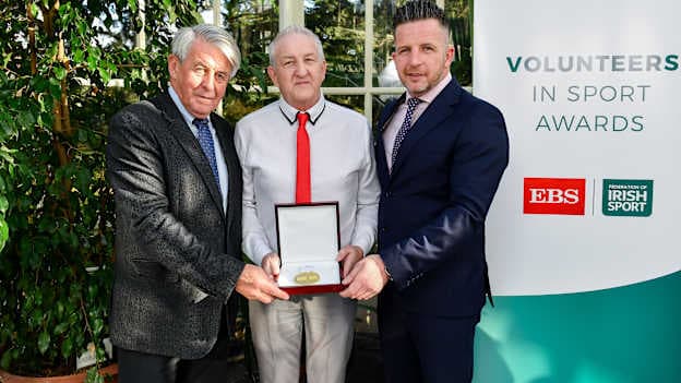 Martin Quinn of Galtee Rovers GAA Club, Co. Tipperary, is presented with his award by Roddy Guiney, Chairperson of the Federation of Irish Sport, left, and Richard Gernon, Regional Manager EBS, during the Volunteers in Sport Awards presented by Federation of Irish Sport with EBS at Farmleigh House in Phoenix Park, Dublin. 