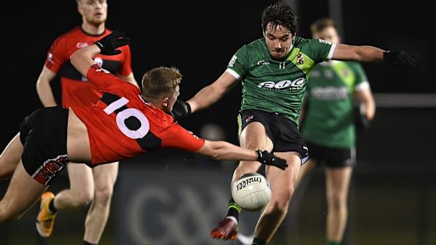 Patrick Finnegan, Queen's University, and Jack Murphy, UCC, in Electric Ireland Sigerson Cup action.