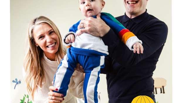 Former Laois footballers Sarah Quigley and Niall Donoher with their son Dan. 