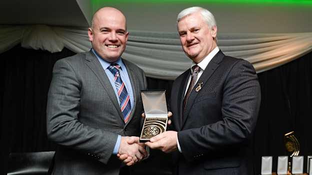 Former GAA President Aogan Ó Fearghaíl presenting Noel Duffy with a MacNamee Award in 2016.