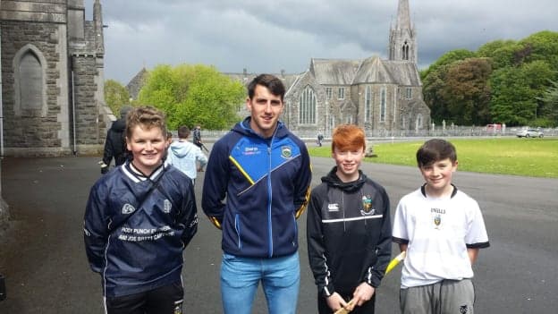 Tipperary hurler Patrick Maher pictured with Cistercian College First Year students Sean Treacy, Peter Dillon, and John Nolan.