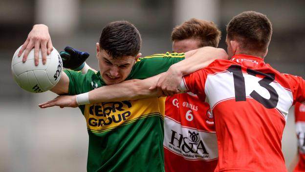 Ferdia O Brien, Kerry, and Shea Downey collide at Croke Park.