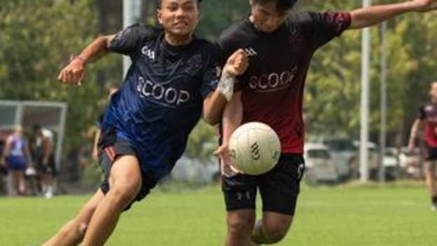 Bin Daro and Touch phanouch jostling during Cairde Khmer's 2022 St Patrick's Day interclub game.