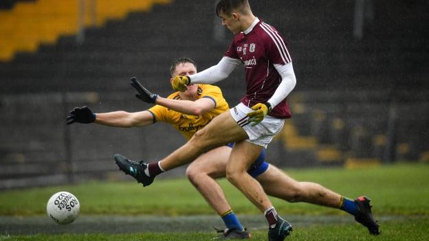 Ryan Monahan of Galway shoots to score his side's third goal, despite the attempts of Colin Walsh of Roscommon, during the EirGrid Connacht GAA Football U20 Championship Final match between Galway and Roscommon at Tuam Stadium in Tuam