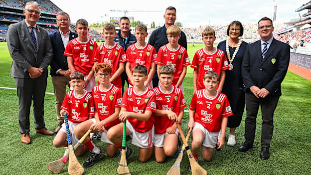The Cork team pose for a group photo with Uachtarán Chumann Lúthchleas Gael Jarlath Burns, Uachtarán of the Camogie Association, Brian Molloy, Head of the Hurling Development Committee, Terry Reilly, GAA National Head of Hurling William Maher, Anne Horan, President, INTO, and Gary Farrell, President, Cumann na mBunscol with players, back row, left to right, Cillian Cunningham, Dernakesh N.S, Cootehill, Cavan, Gerard Connor, Scoil Mhuire na mBuachaillí, Castlebayney, Monaghan, Oisín Rice, Scoil Mhuire, Latton, Monaghan, Davin Finn, St Ciarán’s N.S, Moore, Roscommon, and Finnian O’Connor, Cliffoney N.S, Cliffoney, Sligo, front row, Cian Connell, St Mary’s N.S, Edgeworthstown, Longford, Joshua Hill, St Ronan’s P.S, Lisnaskea, Fermanagh, Connla Gilligan, Scoil An Choimín, Cloghan, Donegal, Robbie Mallon, St Mary’s Ballygunner, Waterford City, Waterford, and Tommy Houlihan, Bunscoil Bhothar na Naomh, Lismore, Waterford, before the GAA INTO Cumann na mBunscol Respect Exhibition Go Games at the GAA Hurling All-Ireland Senior Championship semi-final match between Cork and Dublin at Croke Park in Dublin. Photo by Ray McManus/Sportsfile