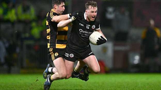 Paul Devlin, Kilcoo, and Patrick O'Reilly, Crosserlough, in AIB Ulster Club SFC action. Photo by Ben McShane/Sportsfile