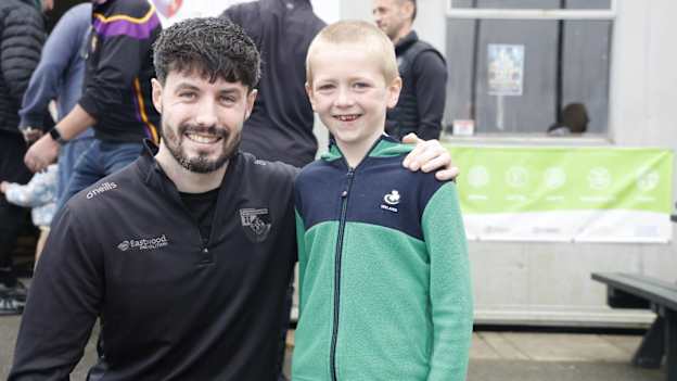 Carryduff star James Guinness pictured with a young supporter at the club's meet and greet ahead of the Down SFC Final. 