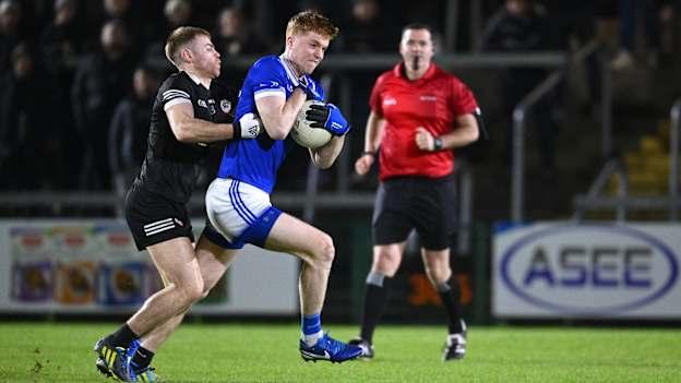 Gavin McPhillips, Scotstown, and Aaron Morgan, Kilcoo, in AIB Ulster Club SFC action. Photo by Ramsey Cardy/Sportsfile