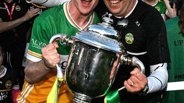 Adam Screeney of Offaly celebrates with his dad Keith and the James Nowlan Cup after the oneills.com GAA Hurling All-Ireland U20 Championship final match between Offaly and Tipperary at UPMC Nowlan Park in Kilkenny. Photo by Ray McManus/Sportsfile.