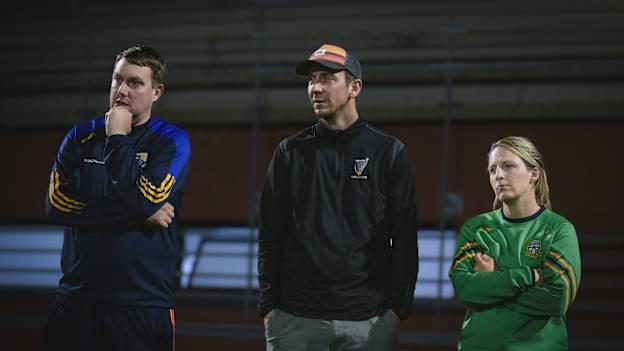 Leinster GAA coach developers, Paddy O'Connor, Jamie Queeney, and Jenny Rispin watch on during a coaching session in Galicia. 