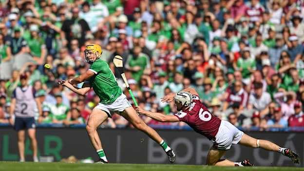 Cathal O'Neill, Limerick, and Daithí Burke, Galway, in All-Ireland SHC Final action at Croke Park. Photo by Stephen McCarthy/Sportsfile