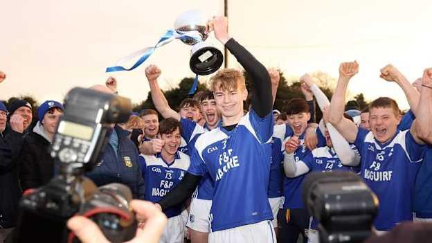 Kilmessan captain, Harry Cahill, lifts the cup after his team's victory over Trim in the 2023 Meath U21A Hurling Final. 
