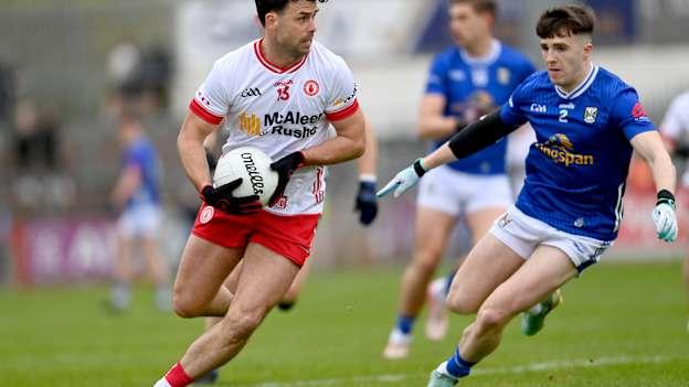 Darren McCurry, Tyrone, and Cian Reilly, Cavan, in Ulster SFC quarter-final action. Photo by Ramsey Cardy/Sportsfile