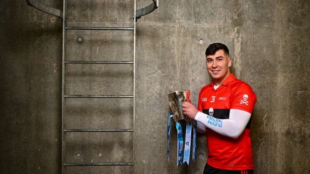 University College Cork footballer Dylan Foley poses for a portrait with the Sigerson Cup before the draw for the Electric Ireland GAA Higher Education Championships at Croke Park in Dublin. Photo by Piaras Ó Mídheach/Sportsfile.