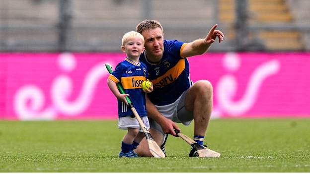 Noel McGrath of Tipperary and his son Sam, age 2, in an empty stadium after the GAA Hurling All-Ireland Senior Championship semi-final match between Kilkenny and Tipperary at Croke Park in Dublin. Photo by Ramsey Cardy/Sportsfile