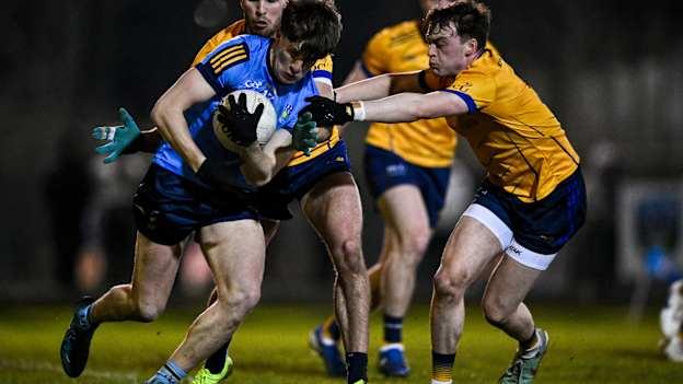 Daire Cregg of UCD in action against Bryan Masterson, right, and Alex Gavin of DCU Dóchas Éireann during the Electric Ireland Higher Education GAA Sigerson Cup Round 2 match between UCD and DCU at Billings Park in Belfield, Dublin. Photo by Ben McShane/Sportsfile