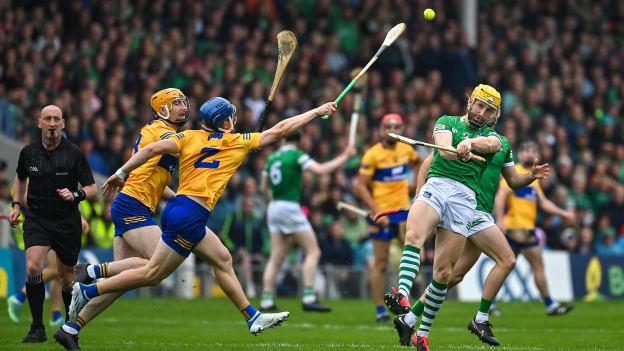 Séamus Flanagan of Limerick scores a point despite the best efforts of David Fitzgerald and Rory Hayes of Clare during the 2022 Munster GAA Hurling Senior Championship Final match between Limerick and Clare at FBD Semple Stadium in Thurles, Tipperary. Photo by Brendan Moran/Sportsfile.