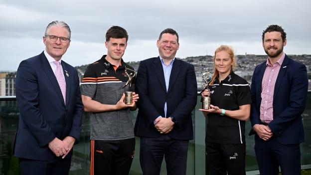 PwC GAA/GPA Player of the Month for May Cork hurler Darragh Fitzgibbon, second from left, and PwC GPA Player of the Month for May, Waterford camogie player Beth Carton, second from right, with Uachtarán Chumann Lúthchleas Gael Jarlath Burns, PwC partner Declan Maunsell, and GPA CEO Tom Parsons, at PwC offices in Cork. Photo by Seb Daly/Sportsfile.
