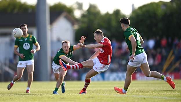 Steven Sherlock of Cork kicks a two-point score despite the tackle of Ronan Ryan of Meath during the GAA Football All-Ireland Senior Championship Round 1 match between Cork and Meath at Páirc Uí Rinn in Cork. Photo by Ben McShane/Sportsfile.