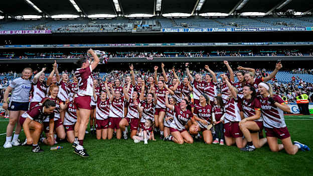 The Galway team, including Aoife Donohue, 12, celebrate with the O'Duffy Cup after the Glen Dimplex All-Ireland Senior Camogie Championship final match between Cork and Galway at Croke Park in Dublin. Photo by Ramsey Cardy/Sportsfile.