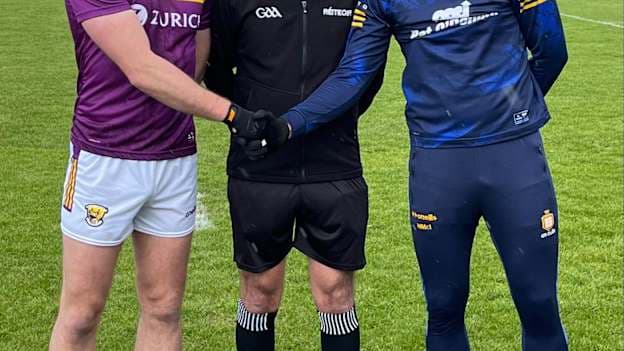 Wexford captain Eoghan Nolan and Clare captain Mark McInerney pictured with referee Christopher Ryan before their Allianz Football League Division 3 clash in Ennis.